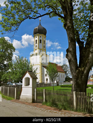 Germany, Bavaria, Aying, village church, bulbous spire, street, tree, fence, white/blue heaven, spring Stock Photo