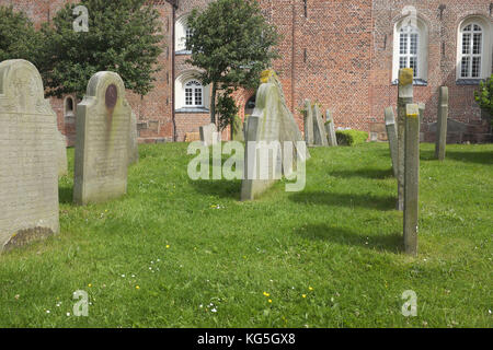 Cemetery in Nieblum, - St. John's church from the 12th century - gravestones tell from the whale catchers Stock Photo