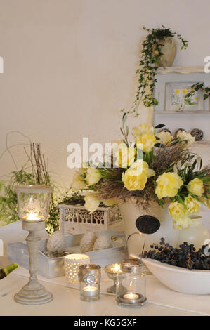 Stilllife with candles and flowers. Vintage Stock Photo