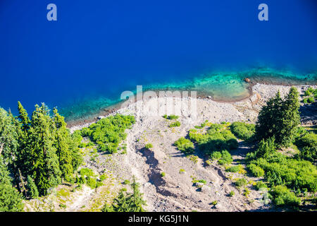 Deep blue water in the huge caldera of the Crater lake National Park, Oregon, USA Stock Photo