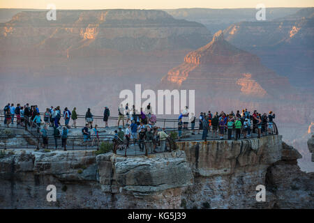 Tourists watching the sunset on a plattform over the Grand Canyon, Arizona, USA Stock Photo