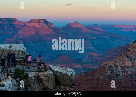 Tourists watching the sunset on a plattform over the Grand Canyon, Arizona, USA Stock Photo