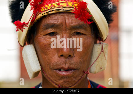 Portrait of a Konyak warrior on the Hornbill festifal in Kisama heritage village Kohima Stock Photo