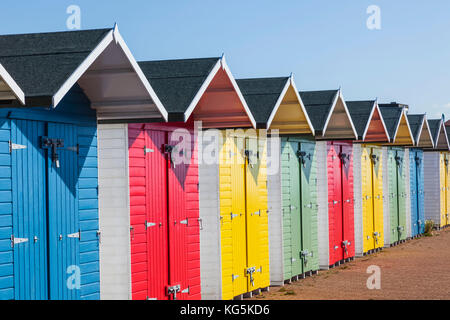 England, East Sussex, Eastbourne, Eastbourne Beach, Colourful Beach Huts Stock Photo