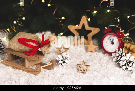 Christmas decoration with sledge stars alarm clock snowflakes Stock Photo