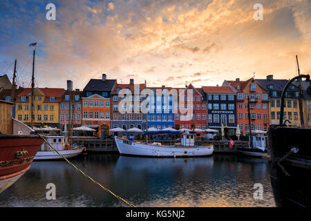 Sunrise on the colourful facades along the harbor in the district of Nyhavn, Copenhagen, Denmark, Europe Stock Photo