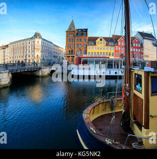 Panoramic of Christianshavn Canal and colorful houses on the background, Copenhagen, Denmark Stock Photo