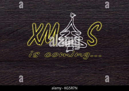 Xmas logo on brown wood concept background. Stock Photo