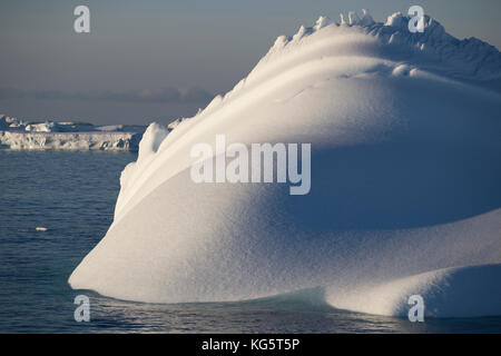 Sharp Corner P Close-up of unique ice sculptures formed by deep fresh snow drifts with ...