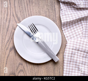 Mock up plate on wooden table with tablecloth Stock Photo