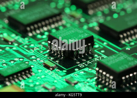 computer mainboard - dual inline modules, surface mounted devices with green, red, blue light - macro shot Stock Photo