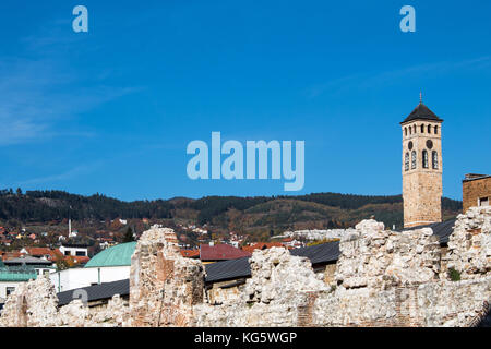 The old clock tower in the center of Sarajevo with blue sky in the background Stock Photo