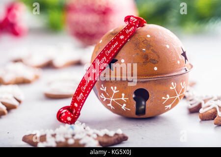 Jingle bell gingerbread cinnamon star anise on table. Stock Photo