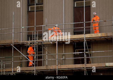 queen street station glasgow renovation scaffolding scaffolders workers hard hats Stock Photo