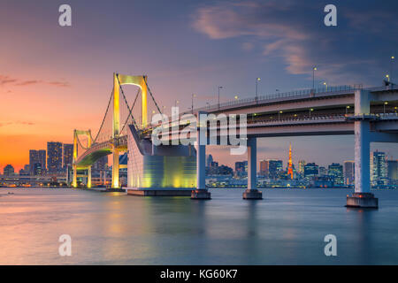 Tokyo. Cityscape image of Tokyo, Japan with Rainbow Bridge during sunset. Stock Photo