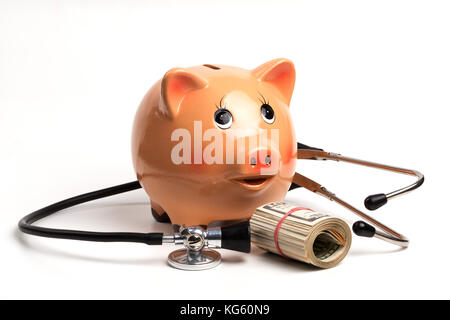 Cute Piggy Bank With Black Stethoscope and Dollar Banknotes Roll Isolated on White Background Stock Photo