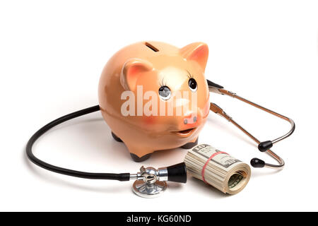 Cute Piggy Bank With Black Stethoscope and Dollar Banknotes Roll Isolated on White Background Stock Photo