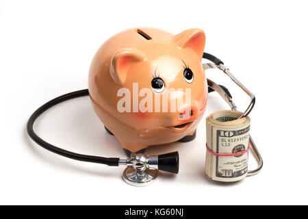 Cute Piggy Bank With Black Stethoscope and Dollar Banknotes Roll Isolated on White Background Stock Photo