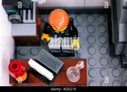 Tambov, Russian Federation - October 18, 2017 Lego office worker on his workplace. Top view. Studio shot. Stock Photo