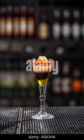 Layered cocktail served on the bar counter Stock Photo