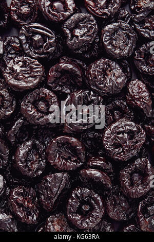 Dried plums or prunes fruit background texture Stock Photo