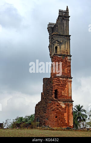 Ruins of 46 meter high belfry of the Church of St Augustine in Old Goa, India. Built by Augustinian friars and abandoned in 1835 Stock Photo