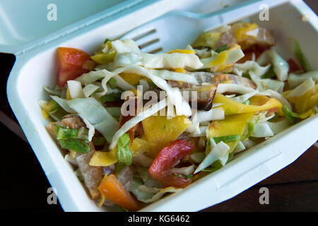 The Seychelles, Praslin, Baie St Anne, food smoked fish salad in biodegradable cardboard container Stock Photo
