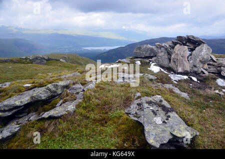 The Summit Pile of Stones on the Scottish Mountain Corbett Creag Mac Ranaich, Scottish Highlands. Stock Photo