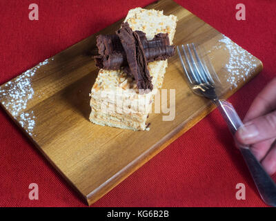 Piece Of Shortcake Cake In Walnuts, Decorated With Crumbs And Chocolate 