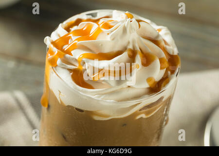 Sweet Homemade Caramel Iced Latte Coffee with Whipped Cream Stock Photo