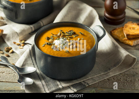Homemade Curry Butternut Squash Soup with Sage and Bread Stock Photo