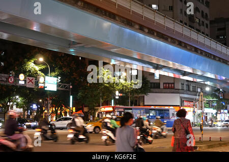 Taipei, Taiwan - October 27, 2017 : Motion of commuters crossing street to take bus or skytrain