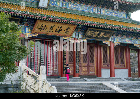 A woman walking in Tianmenshan temple in Hunan Province, China Stock Photo