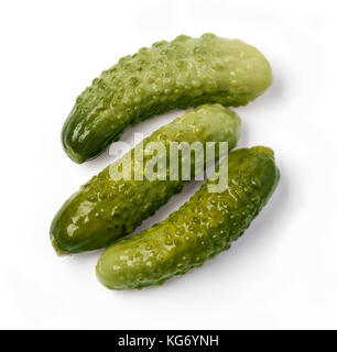 three marinated pickled cucumbers isolated on white Stock Photo