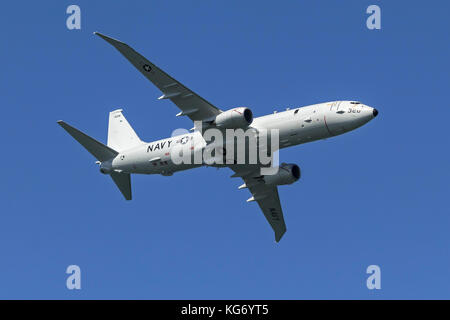 U.S Navy Boeing P-8 Poseidon in flight. Based on the Boeing 737 Next Generation the Poseidon operates in the anti-submarine warfare, anti-surface warf Stock Photo