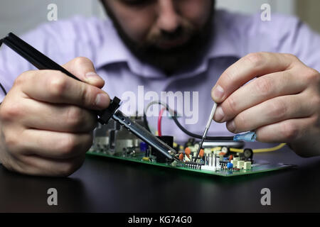 technology engineer of the modern world in a workflow with electronic devices Stock Photo