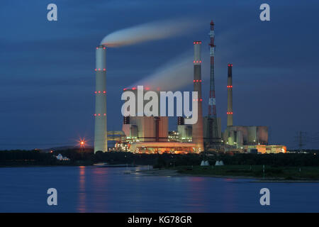 Coal-Fired power plant near Voerde, Germany. In front the  rhine river. Stock Photo