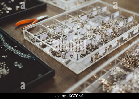 Tools for jewelry making, colorful stone beads. Jewellry workplace. Stock Photo