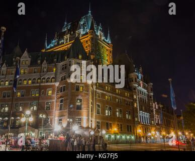 Street performers play before a crowd in front of the Fairmont Chateau Frontenac in Quebec City, Quebec. Stock Photo