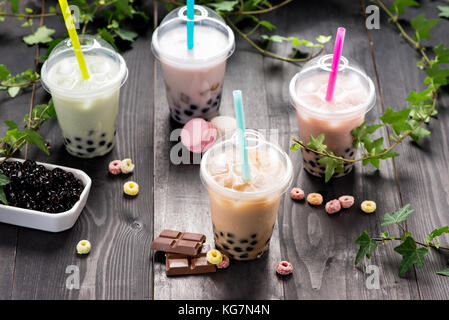 Milky bubble tea with tapioca pearls in plastic cup Stock Photo