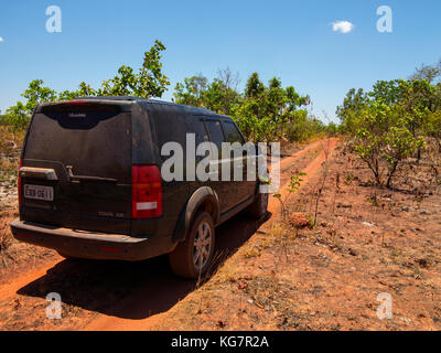 Land Rover vehicle on a dirty road crossing the remote Jalapão National Park, Tocantins estate, Brazil Stock Photo