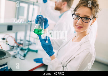 Attractive student of chemistry working in laboratory Stock Photo