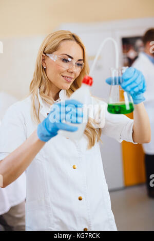 Attractive student of chemistry working in laboratory Stock Photo