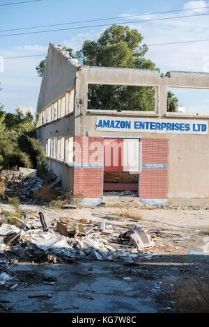 Amazon Enterprises LTD. sign on abandoned industrial building in Larnaca, Cyprus Stock Photo