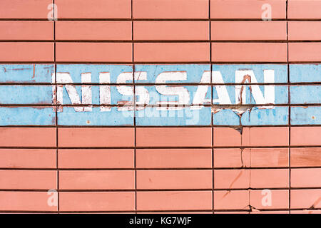 Nissan sign on abandoned industrial building in Larnaca, Cyprus Stock Photo