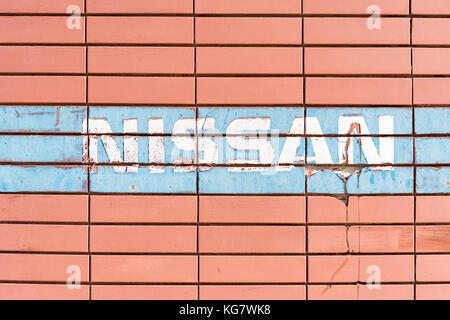Nissan sign on abandoned industrial building in Larnaca, Cyprus Stock Photo