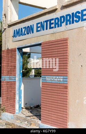 Amazon Enterprises LTD. sign on abandoned industrial building in Larnaca, Cyprus Stock Photo
