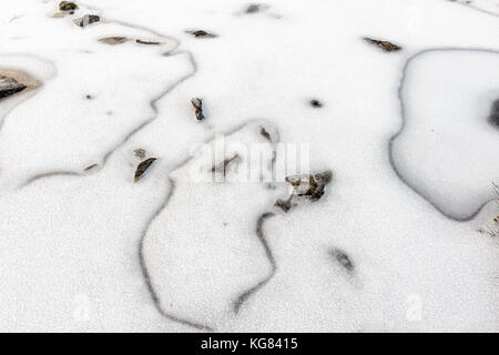 Close-up of surface of frozen water. Picture is taken on a hike from Kroken to Blåkollkoia (cabin for hikers). Krokelvdalen/Skjelnan, Tromsø, Norway. Stock Photo