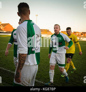 West Auckland, County Durham, UK. 4th November, 2017.  Two Billingham Synthonia players have an altercation on their way down the tunnel at half time after missing a penalty at the end of the first half. They went on to lose 4-0 away to West Auckland in the Northern League Division 1 (c) Paul Swinney/Alamy Live News Stock Photo