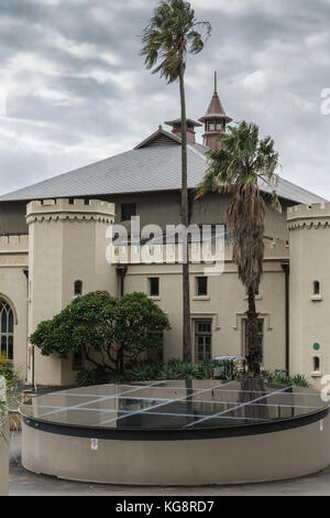 Sydney, Australia - March 23, 2017: Palm tree and black display circle in front of Sydney Conservatory of Music at entrance of Royal Botanical Garden  Stock Photo